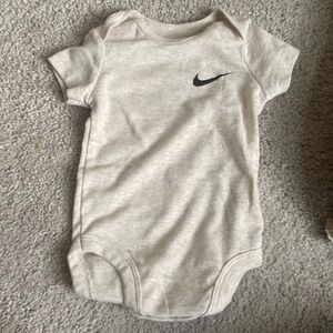 Beige Nike onesie, 6 months old